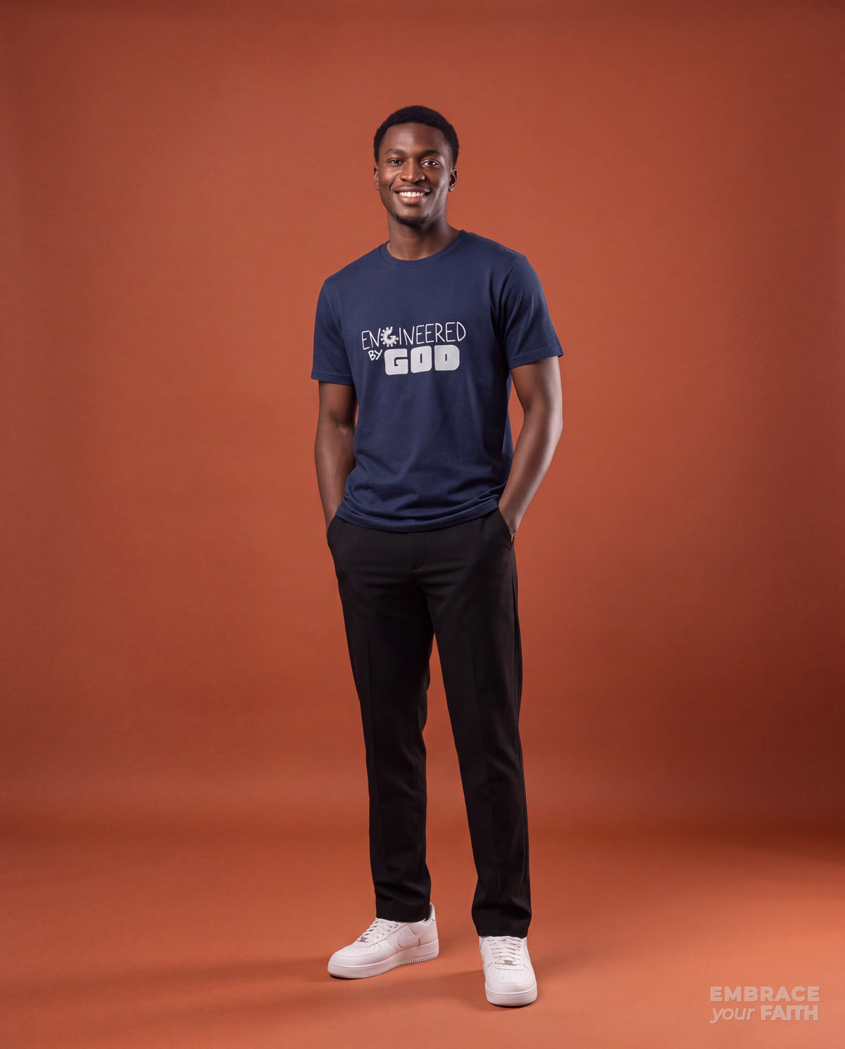EYF model wearing the Engineered By God Classic Unisex T-Shirt (Blue) in Navy