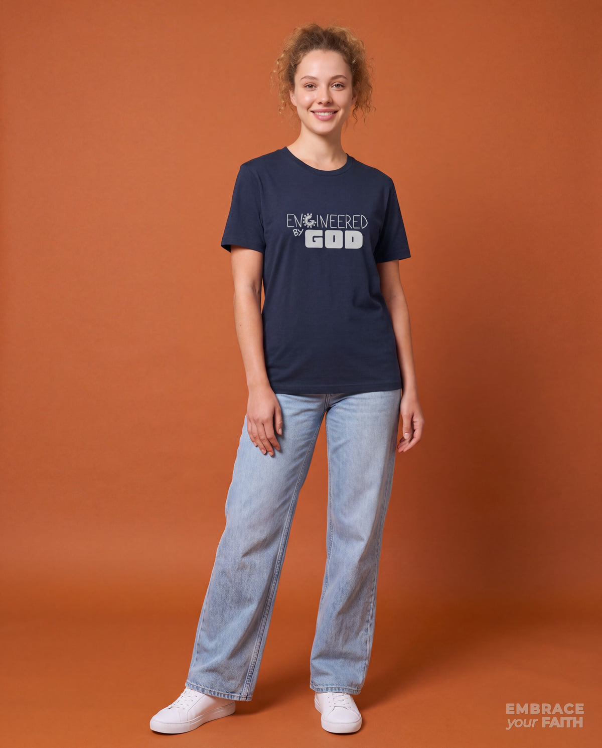 EYF model wearing the Engineered By God Classic Unisex T-Shirt (Blue) in Navy