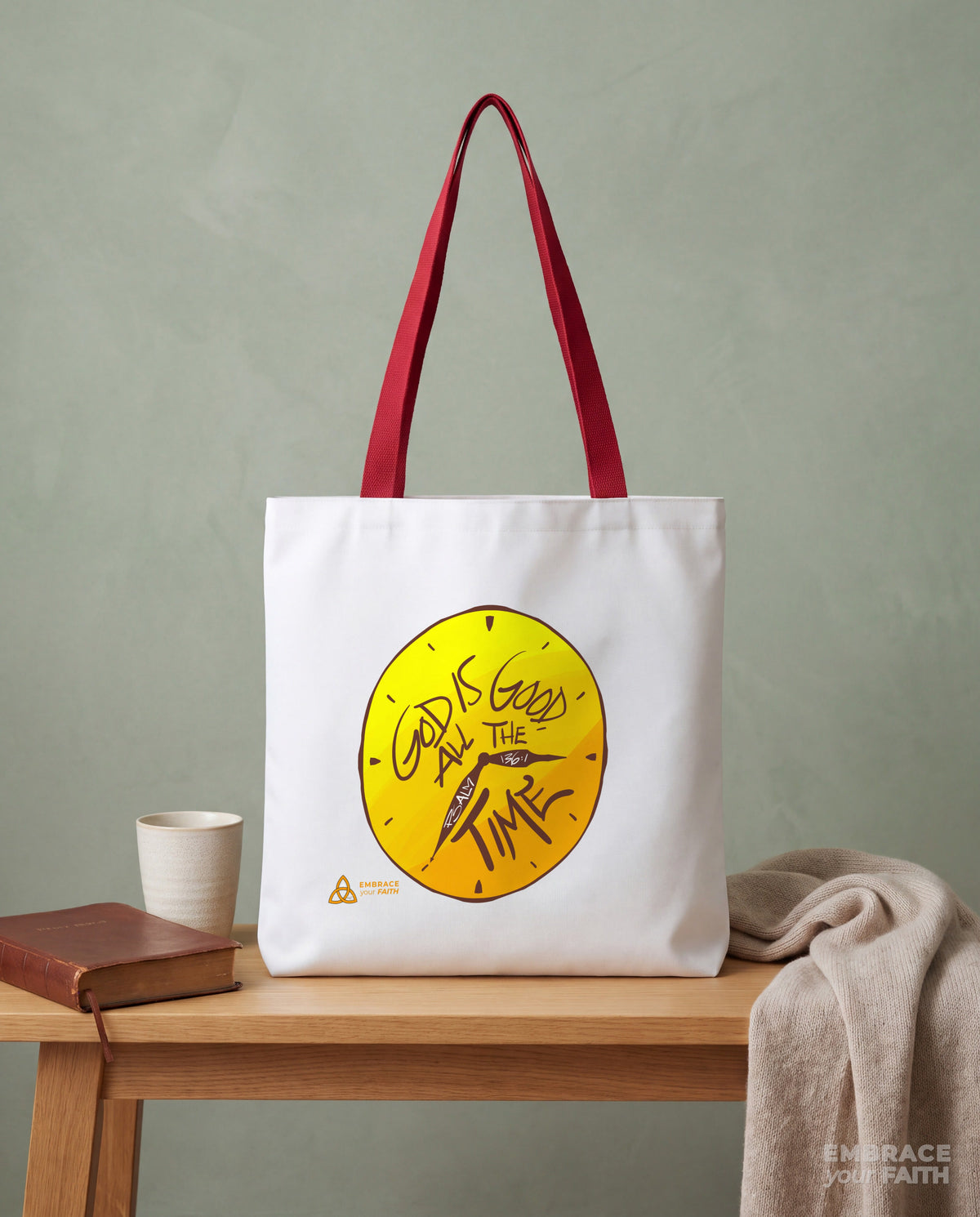 Styled still life of the God Is Good All the Time Tote Bag with Red straps