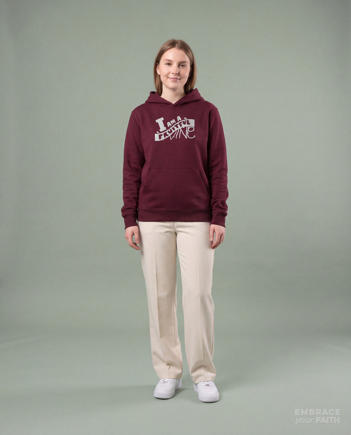 EYF model wearing the I Am a Fruitful Vine Classic Luminous Hologram Unisex Hoodie in Maroon
