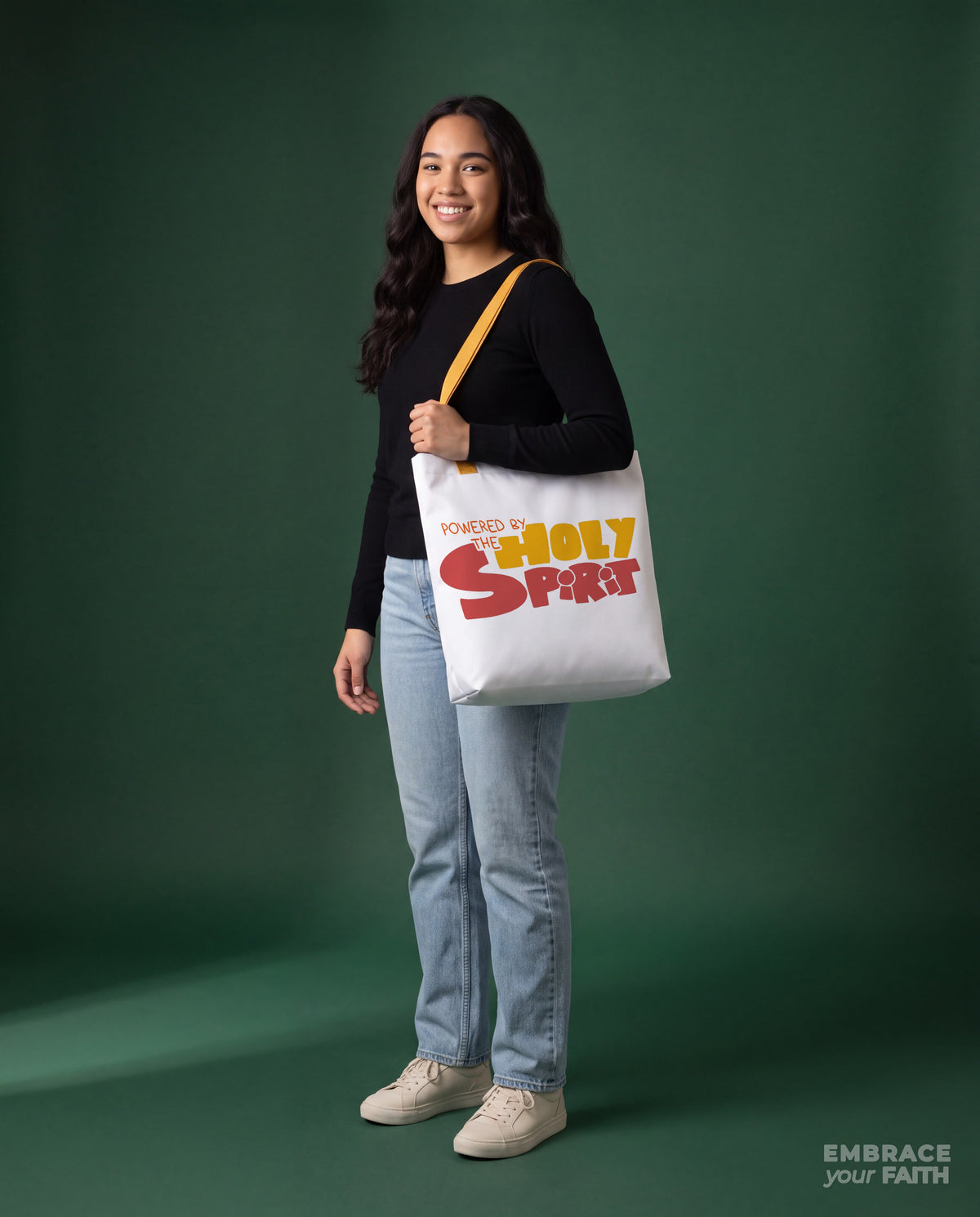 EYF model carrying the Powered by the Holy Spirit Tote Bag