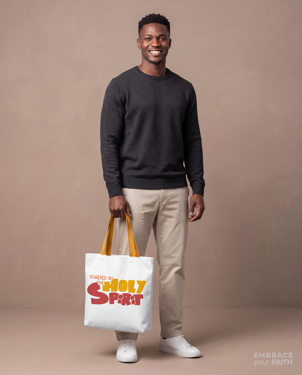 EYF model carrying the Powered by the Holy Spirit Tote Bag