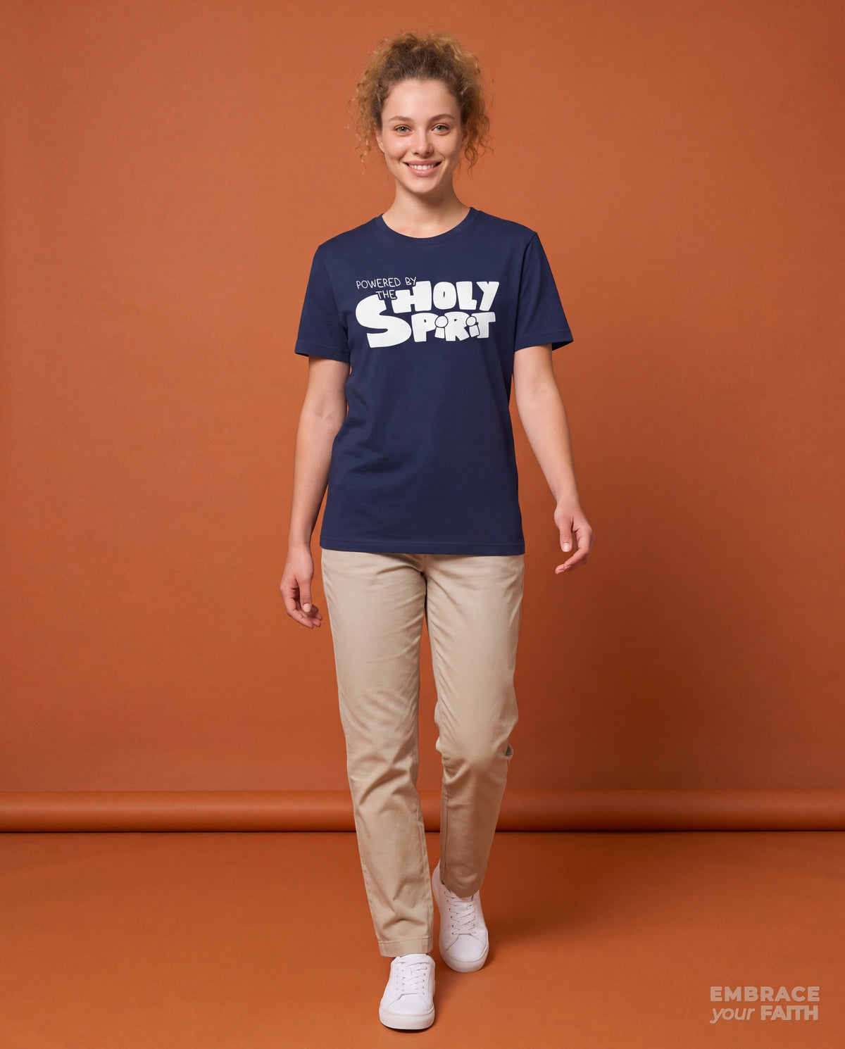 EYF model wearing the Powered by the Holy Spirit Unisex T-Shirt in Navy
