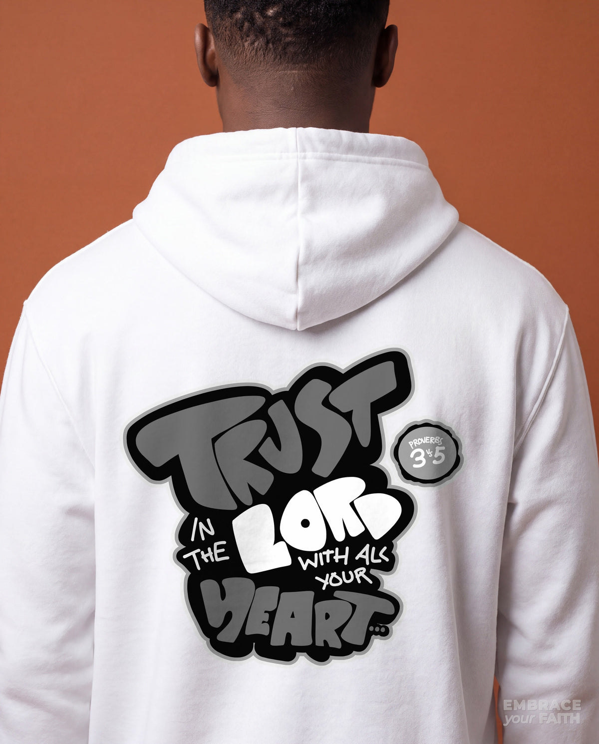 Close-up of the back print on the Trust in The Lord Black and White Unisex Hoodie in White