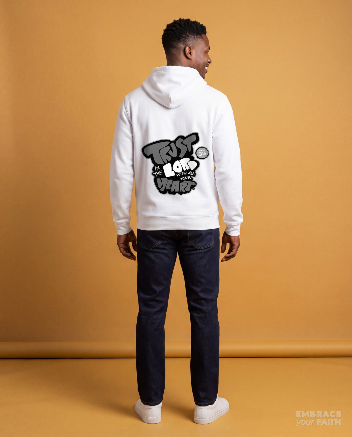 EYF model wearing the Trust in The Lord Black and White Unisex Hoodie in White (back view)