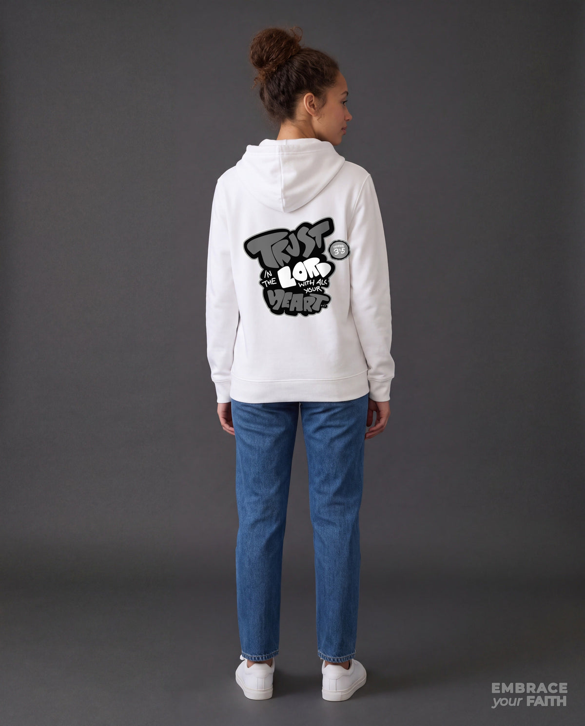EYF model wearing the Trust in The Lord Black and White Unisex Hoodie in White (back view)